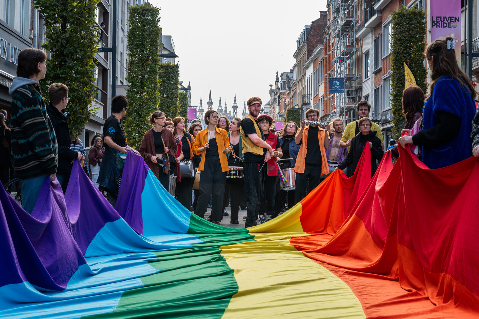 Drummers walk ahead of the flag as the walk moves through the shopping street. Leuven Pride 2025, photo: Ellen Schellens