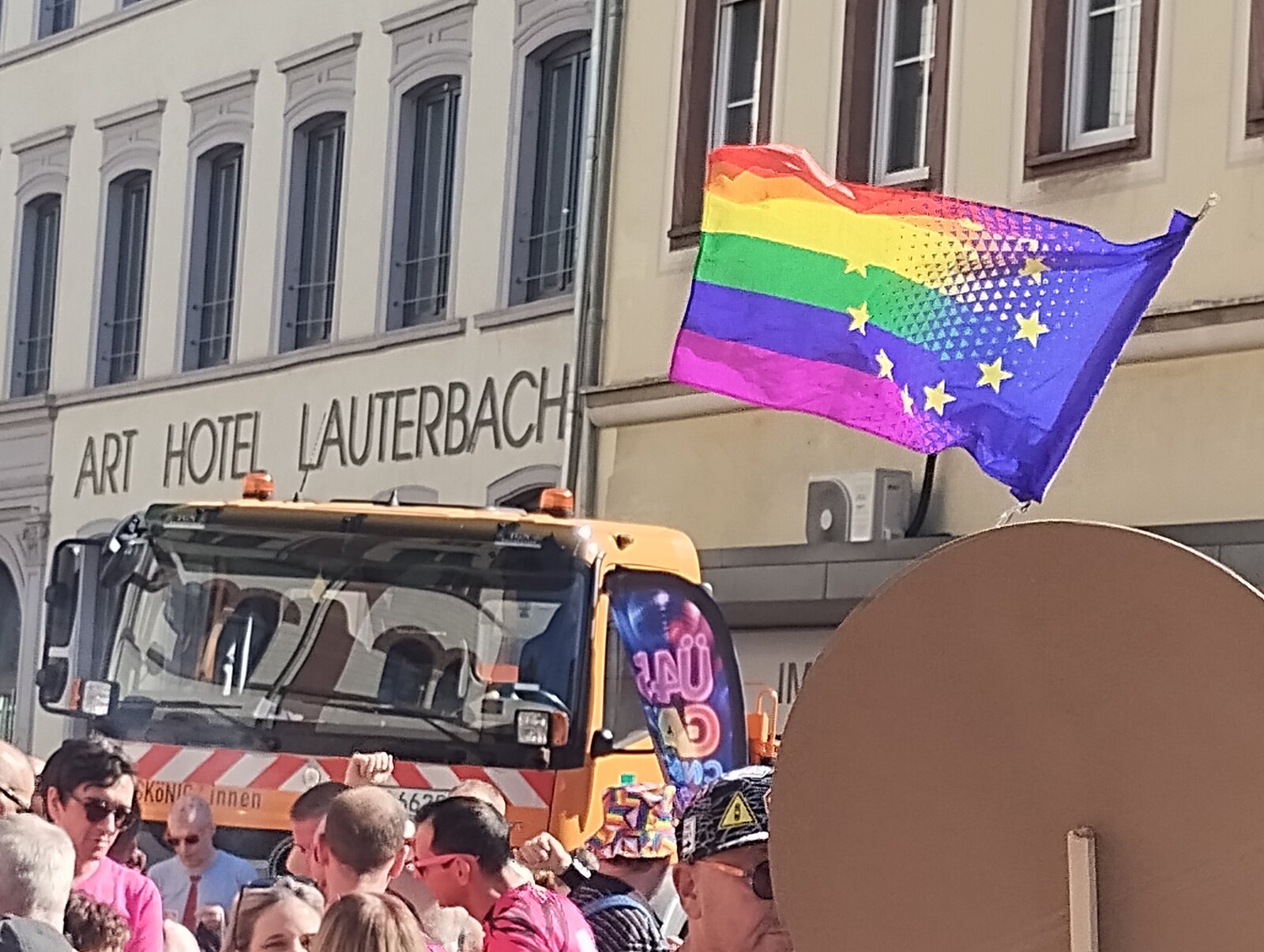 A rainbow flag with EU stars flying from the lead truck in front of the Art Hotel Lauterbach. CSD Lautre 2026, photo: gaycation.eu