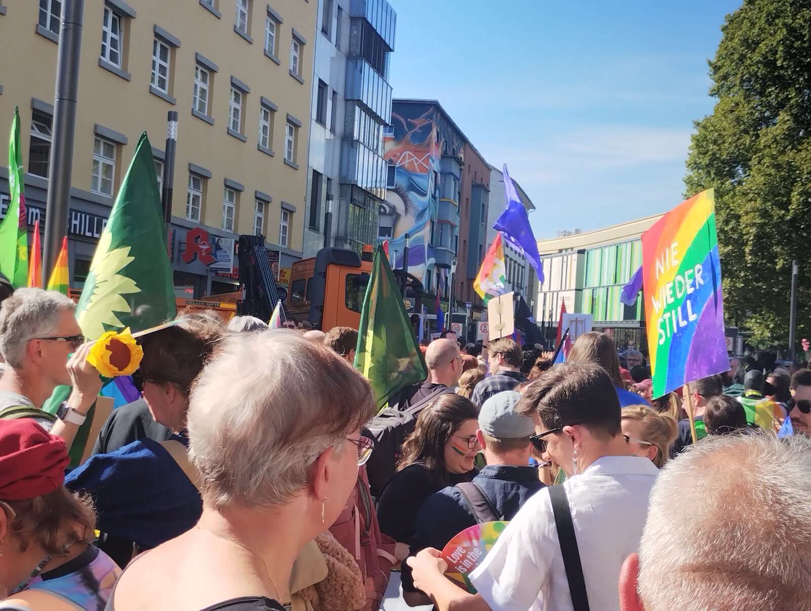 A rainbow placard reading "Nie wieder still" above the crowd at the start. CSD Lautre 2026, photo: gaycation.eu