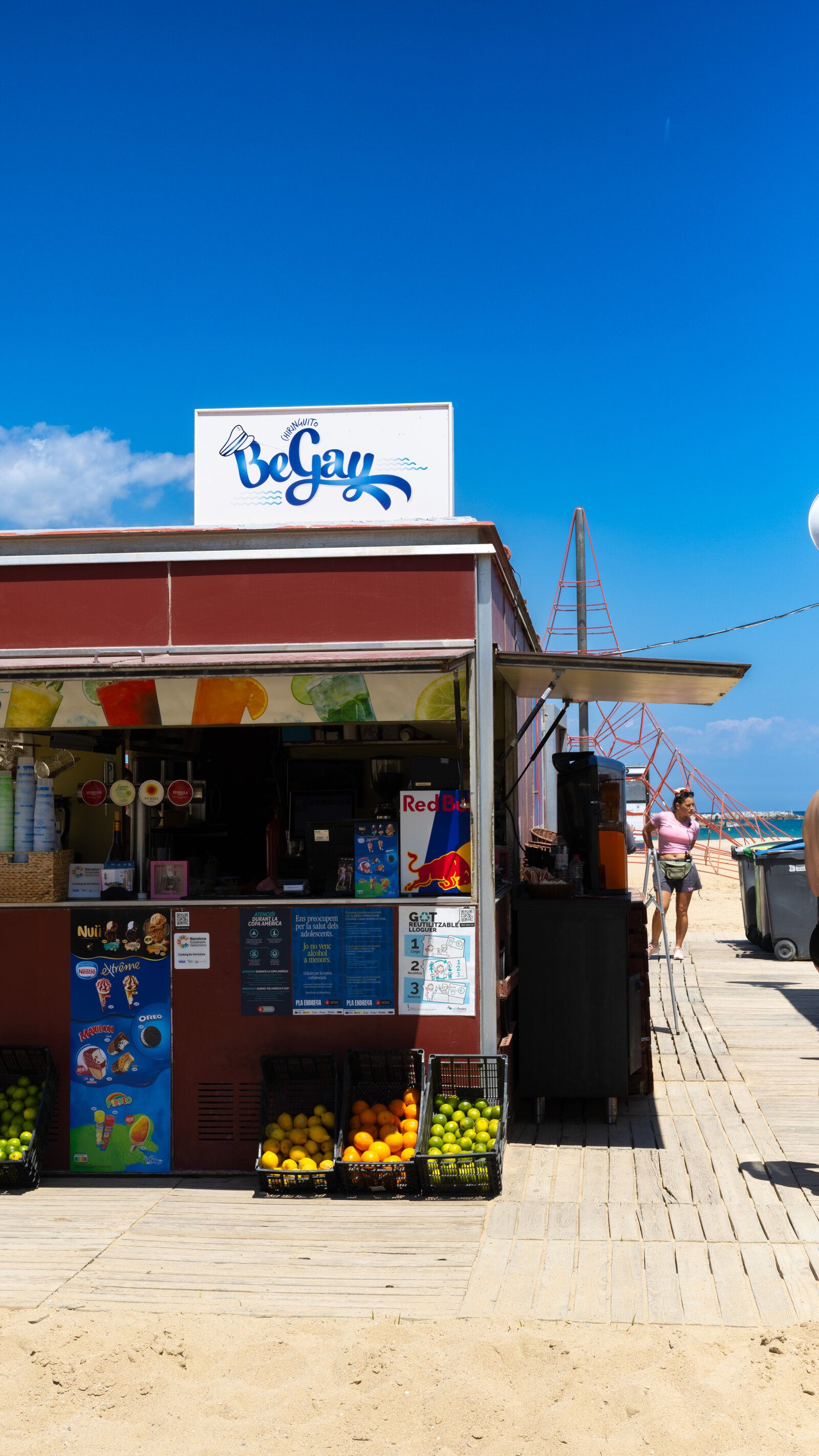 The service window on the boardwalk, with draught taps, the ice cream board and crates of fresh lemons and oranges for the juices.
