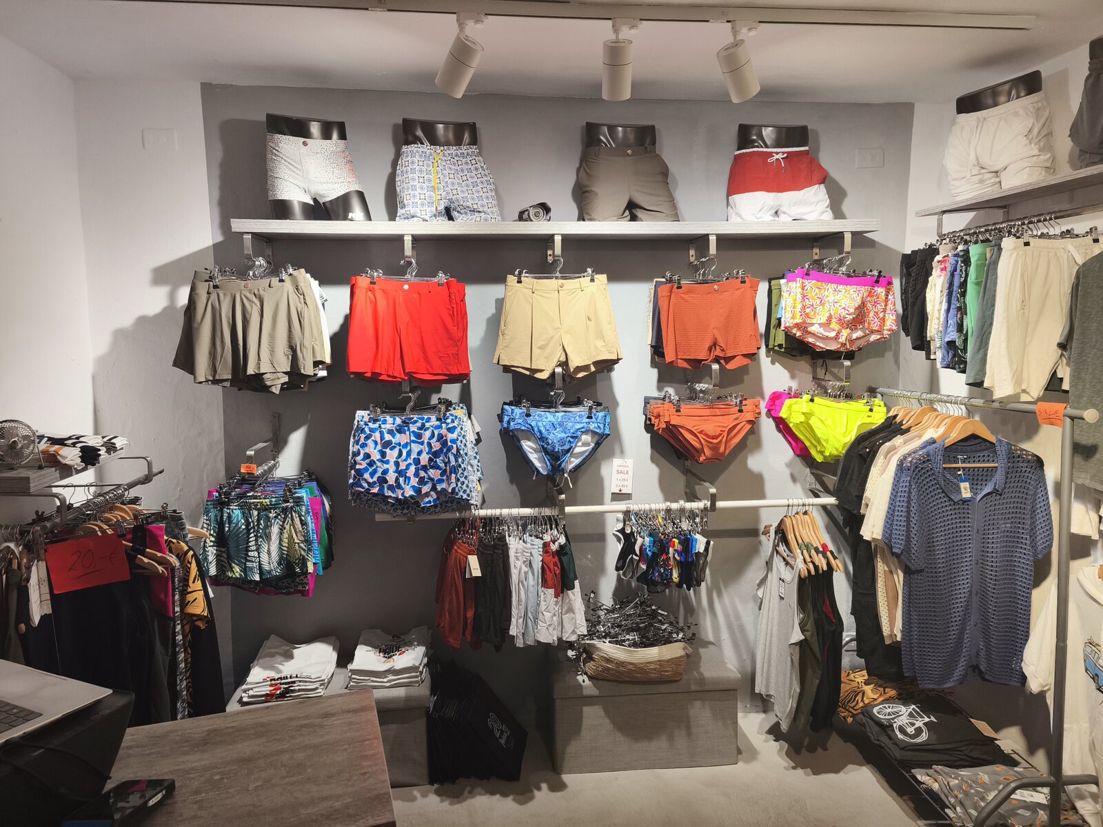 The swimwear wall, shorts, briefs and trunks across three rails.
