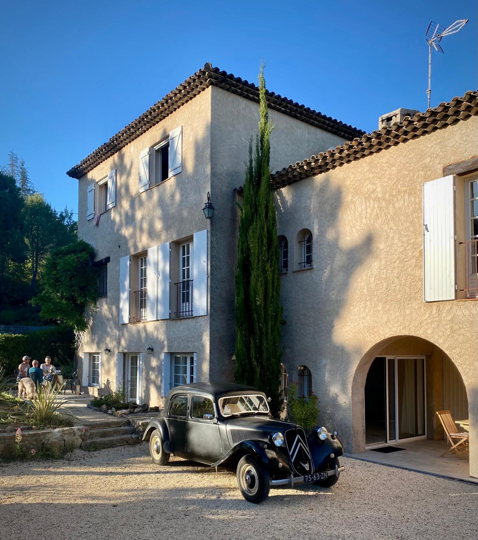 The main house, with a vintage Citroen parked in the courtyard.