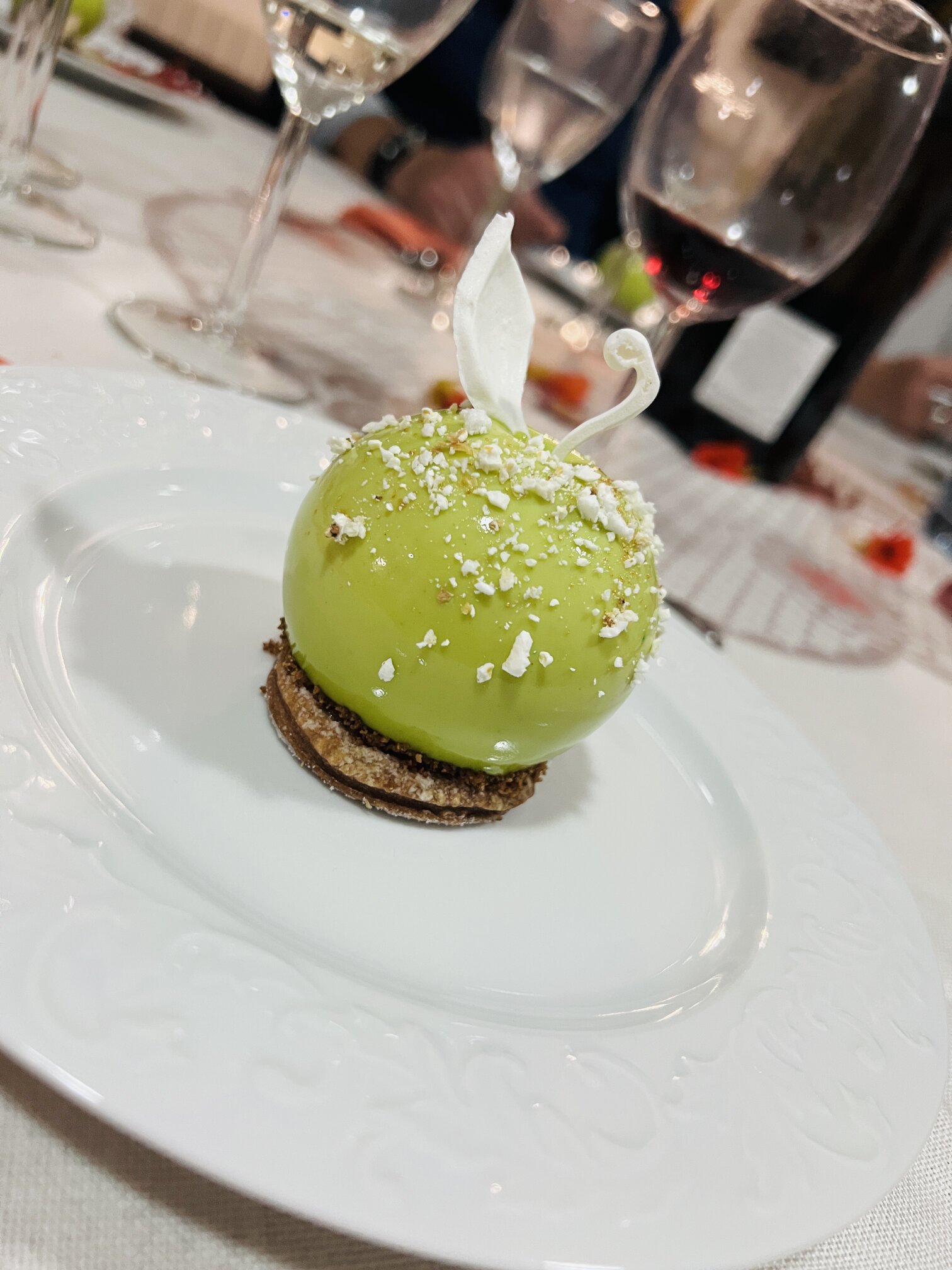 A green glazed dessert with meringue quills.