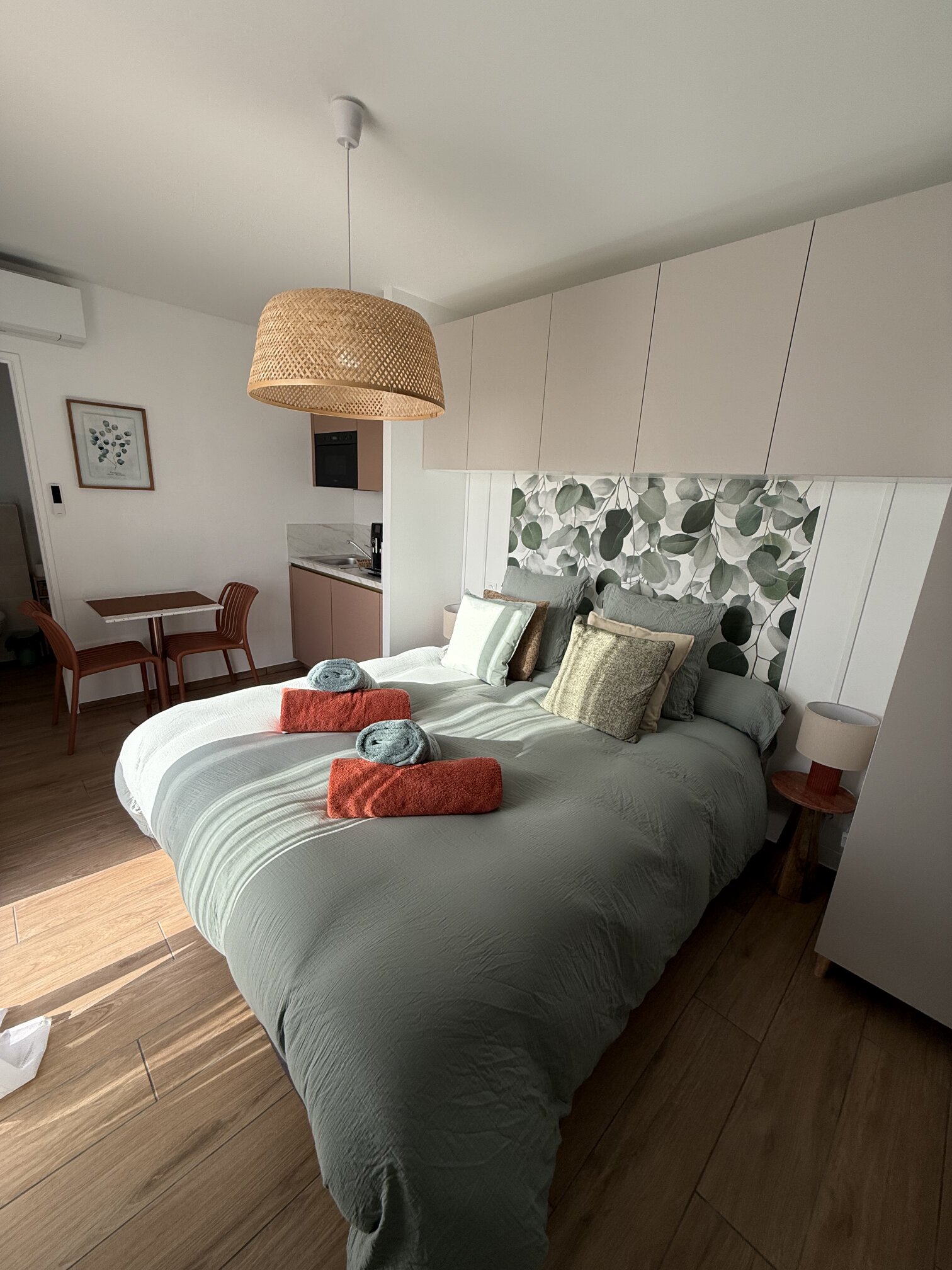 One of the guest rooms, with kitchenette and a small dining table.