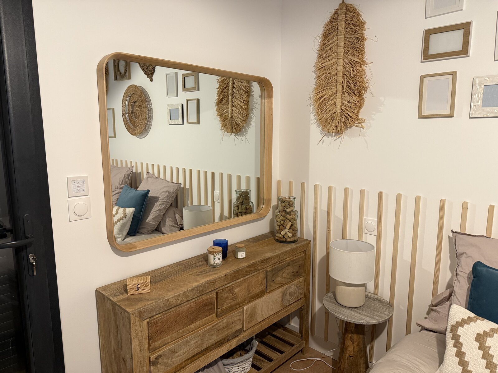 Decor detail in the boho guest room, dresser and rattan accents.