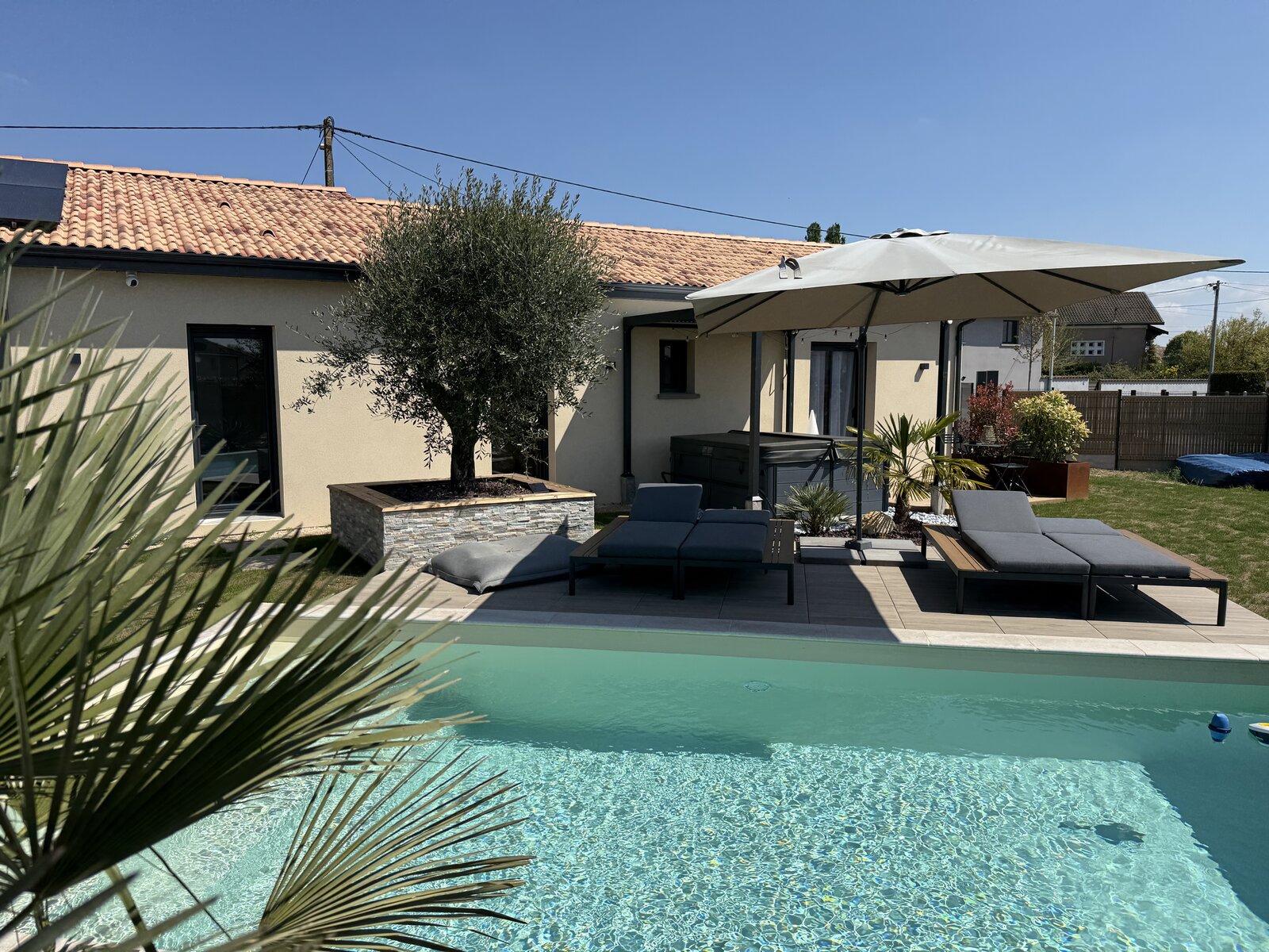 The house and pool seen from across the garden.